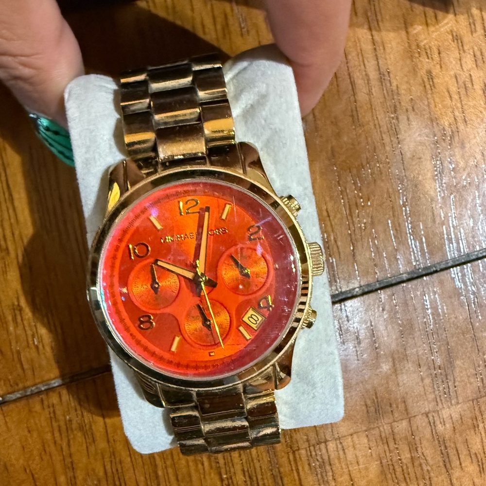 MK orange and gold watch